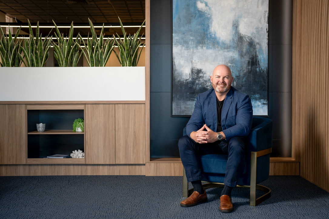 Ron Coleman, founder of Coleman Invest, seated in his office